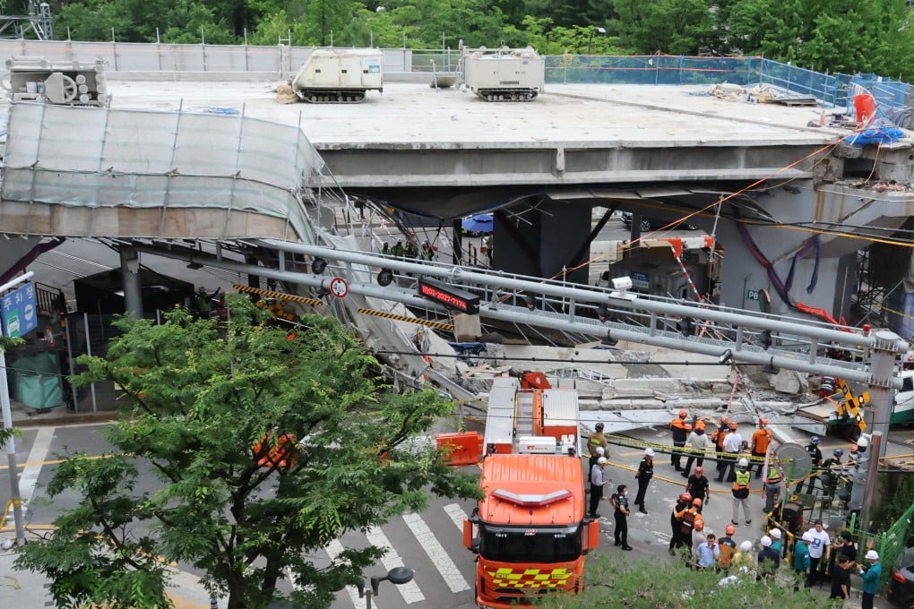 Rescuers search for victims after an overpass collapses in western Seoul on Tuesday. Photo: Yonhap/EPA
