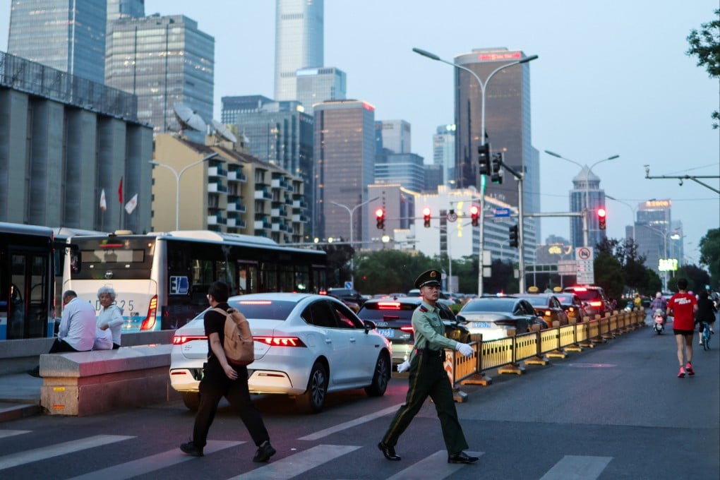 A paramilitary police officer crosses a street near Beijing’s central business district. Photo: Reuters