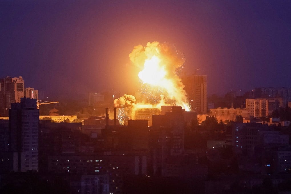 An explosion lights up the sky in Kyiv during a Russian attack on Sunday. Photo: Reuters
