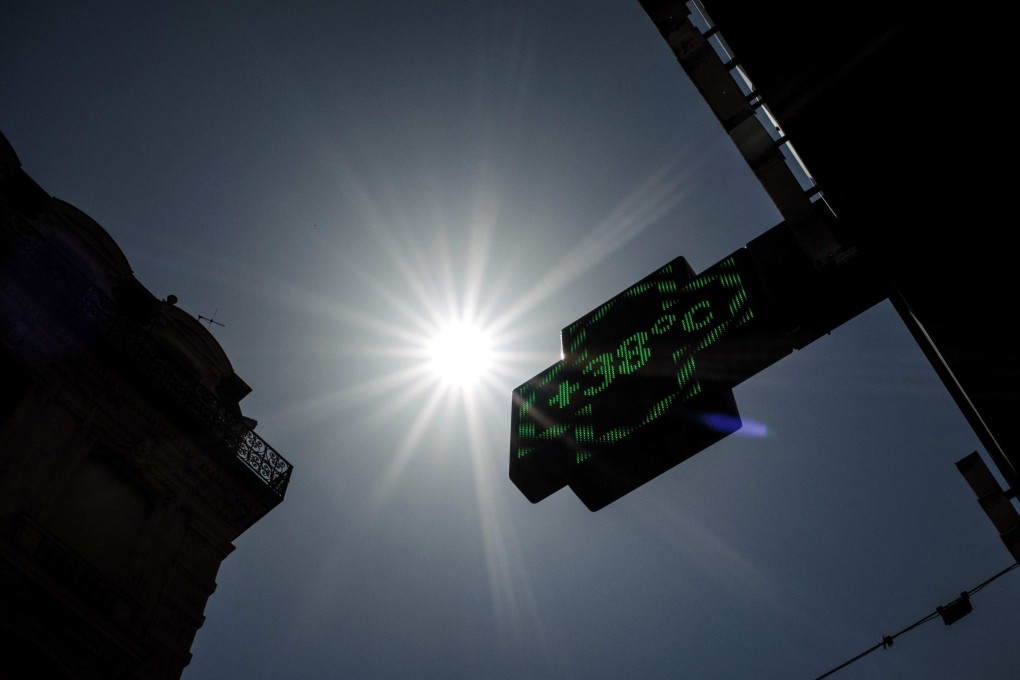 A pharmacy thermometer sign reading 38 degrees Celsius in Lyon on Tuesday, as a heatwave hits France. Photo: AFP