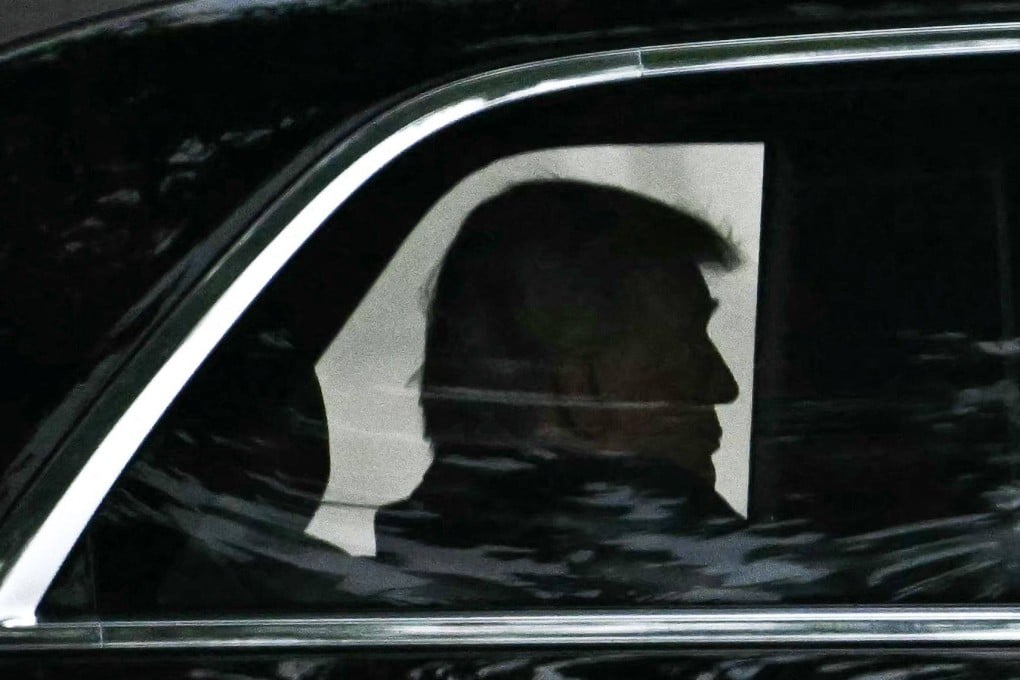US President Donald Trump rides in his motorcade as he leaves Walter Reed National Military Medical Centre on Tuesday. Photo: AFP