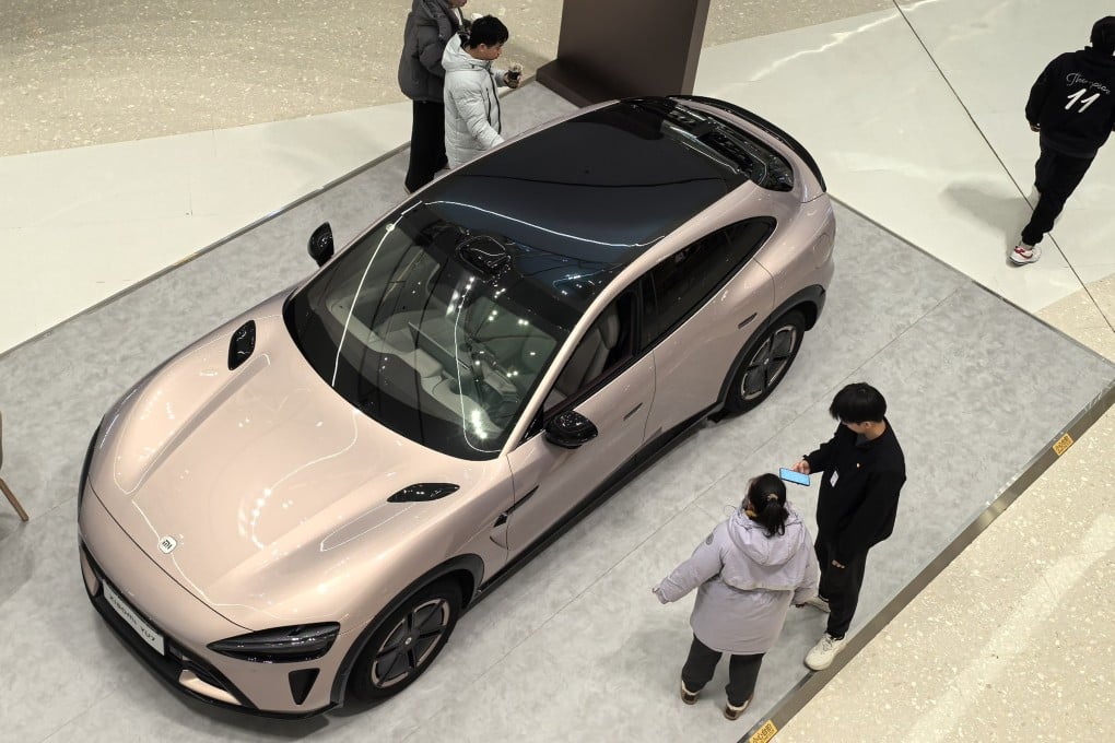 People check the Xiaomi YU7 new energy (EV) car in a new shopping mall in Beijing. Photo: Simon Song