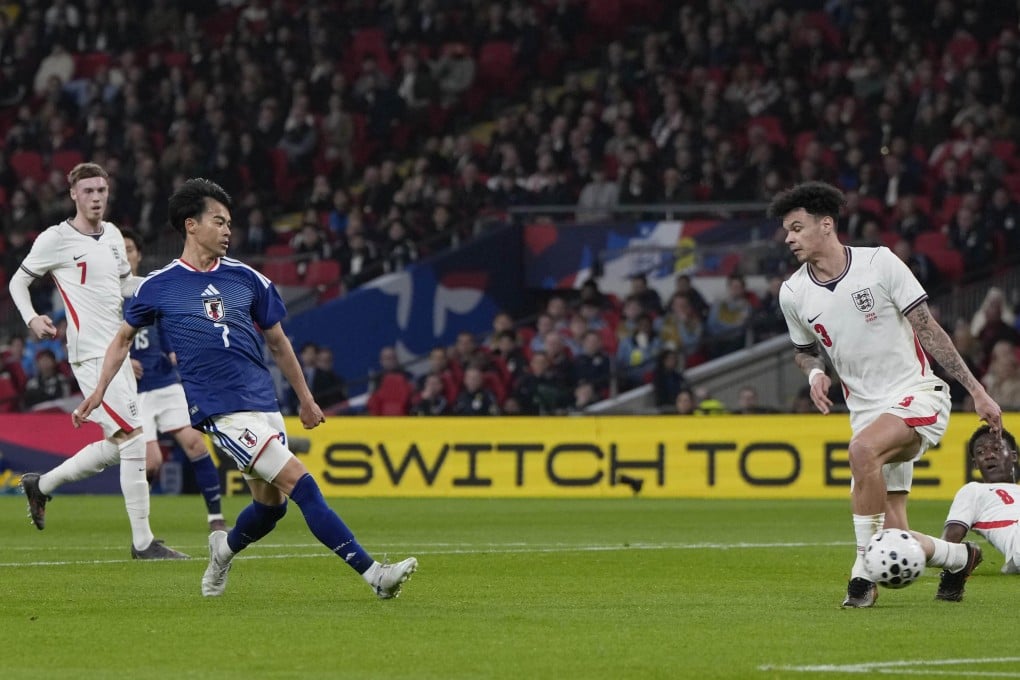 Japan’s Kaoru Mitoma (front left) scores during an international friendly against England at Wembley Stadium in March. Photo: Kyodo