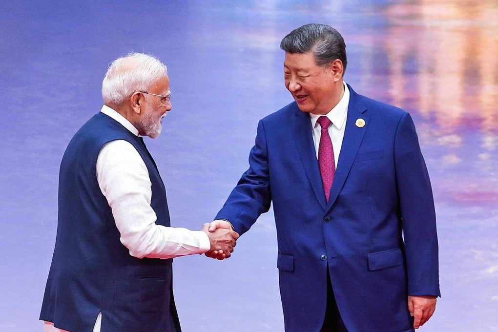 China’s President Xi Jinping shakes hands with India’s Prime Minister Narendra Modi during the welcoming ceremony of the Shanghai Cooperation Organisation summit in Tianjin last August. Photo: Indian Press Information Bureau/AFP
