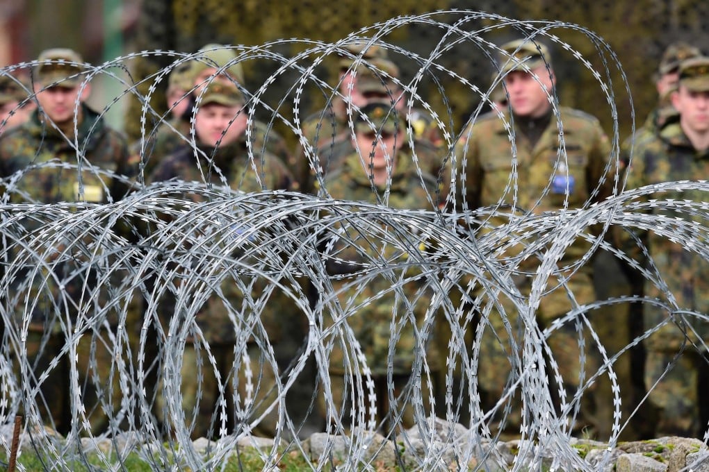 Polish and German soldiers pose outside the Main Command Post at the multinational Nato Corps in Szczecin, Poland in 2016. Photo: AFP