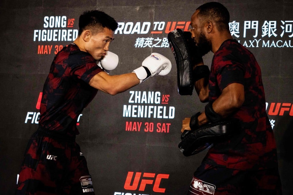 Chinese fighter Song Yadong (left) taking part in a workout session at the opening ceremony of UFC Fight Night at Macau's Galaxy resort on Wednesday. Photo: AFP