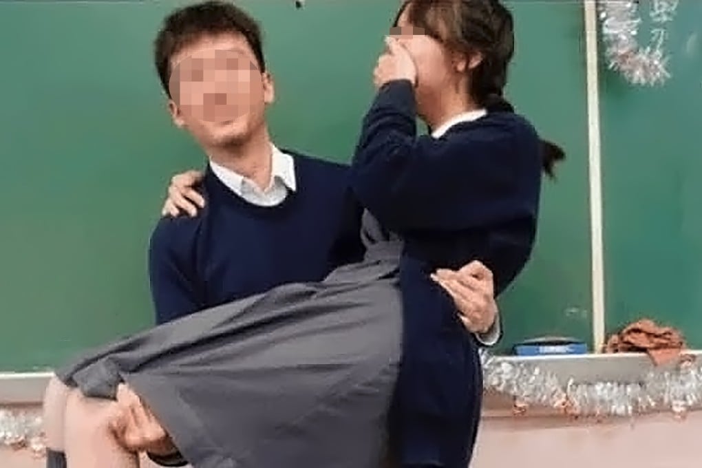 The photo circulating online showing a teacher carrying a female student in his arms. Photo: Threads