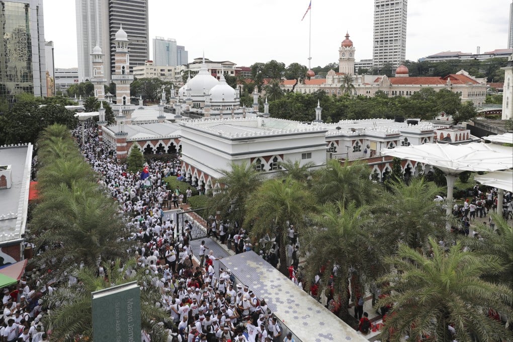 Thousands of protesters rally near a mosque in Kuala Lumpur to celebrate the Malaysian government’s withdrawal of plans to ratify a UN anti-discrimination convention in 2018. Photo: AP