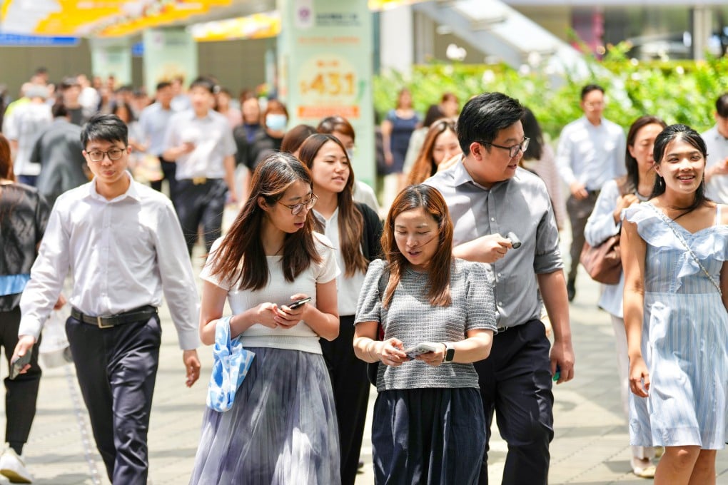 Civil servants leave the government officies in Tamar, Admiralty, for their lunch break on May 28. Photo: Karma Lo