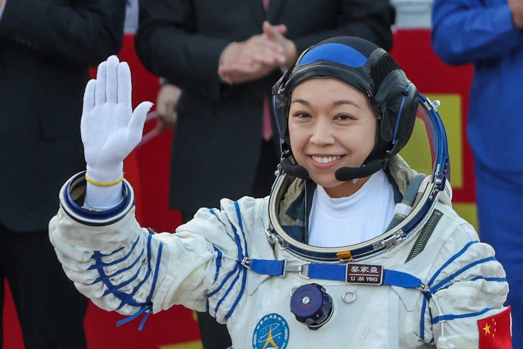 Lai Ka-ying, the first astronaut from Hong Kong, waves before taking part in the Shenzhou-23 mission to the Tiangong space station, at Jiuquan Satellite Launch Centre in Gansu province on May 24. Photo: Reuters