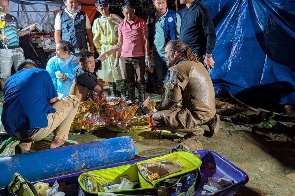 Finnish cave diver Mikko Paasi with the first survivor rescued from a flooded cave network in Xaysomboun province, central Laos, on Saturday. Photo: Josh Richards/dpa