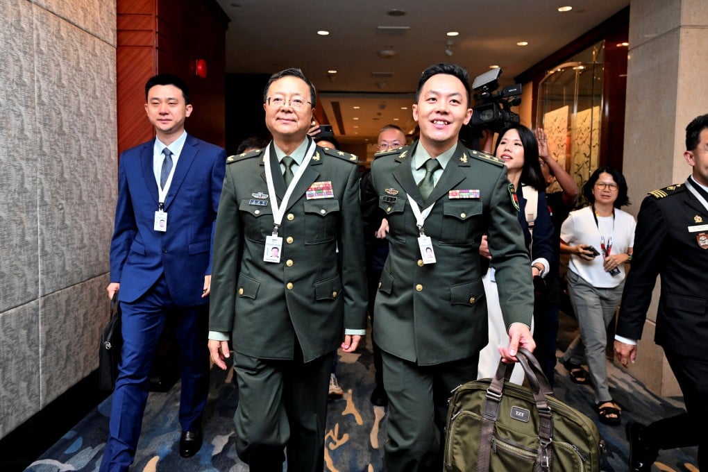 Major General Meng Xiangqing (second from left) leaves a special session at the Shangri-La Dialogue security forum in Singapore on Saturday. Photo: Reuters