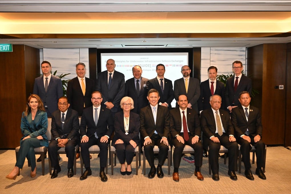 Singapore’s Minister for Defence Chan Chun Sing (centre) with representatives from 16 partner countries during the launch of the Guiding Principles for Underwater Infrastructure Defence Exchanges at the Shangri-La Dialogue on Saturday. Photo: Singapore’s Ministry of Defence