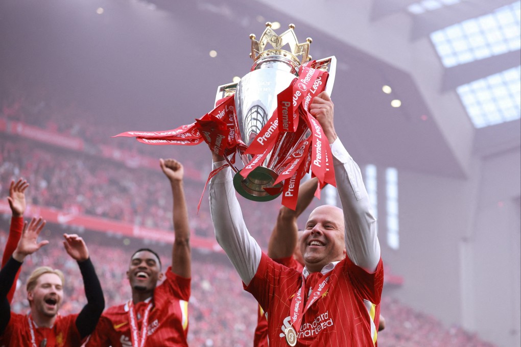 Liverpool manager Arne Slot celebrates with the trophy after winning the Premier League. Photo: Reuters