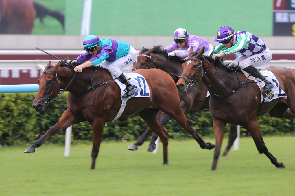 Zac Purton and Rising World (left) race to victory in the Hong Kong Wu Hua General Association Cup Plate at Sha Tin. Photo: Kenneth Chan.