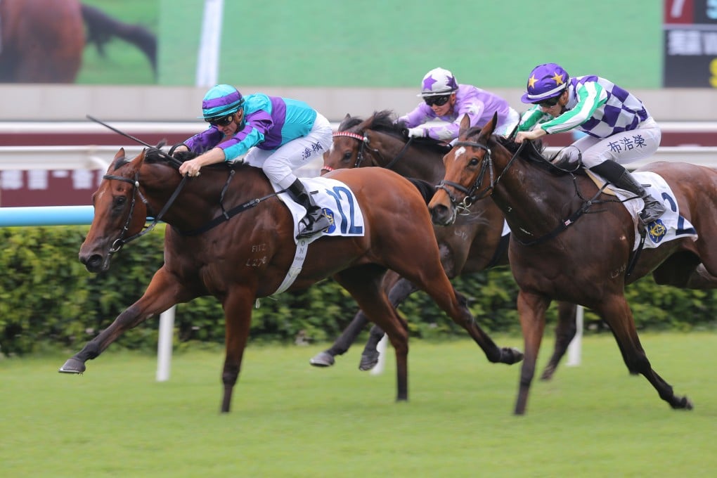 Zac Purton and Rising World (left) race to victory in the Hong Kong Wu Hua General Association Cup Plate at Sha Tin. Photo: Kenneth Chan.
