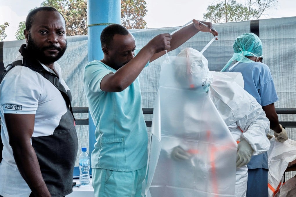 Medical workers from the Alliance for International Medical Action don personal protective equipment as they set up a treatment centre for the Ebola response in Rwampara, DR Congo, on Friday. Photo: Reuters