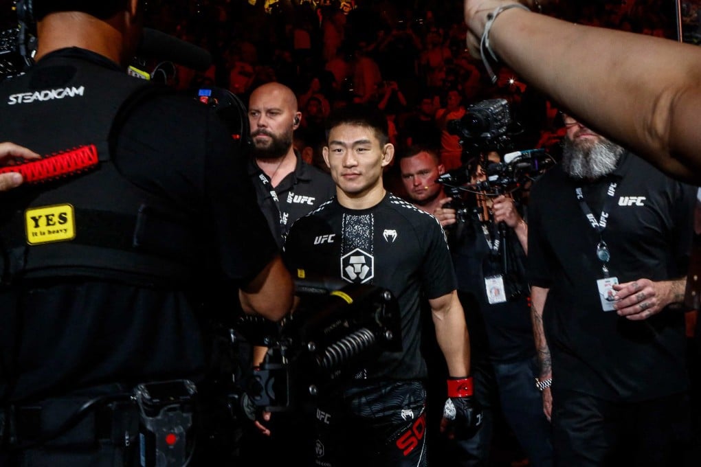 Chinas Song Yadong (centre) arriving for his bout against Brazils Deiveson Figueiredo during UFC Fight Night in Macau on Saturday. Photo: AFP