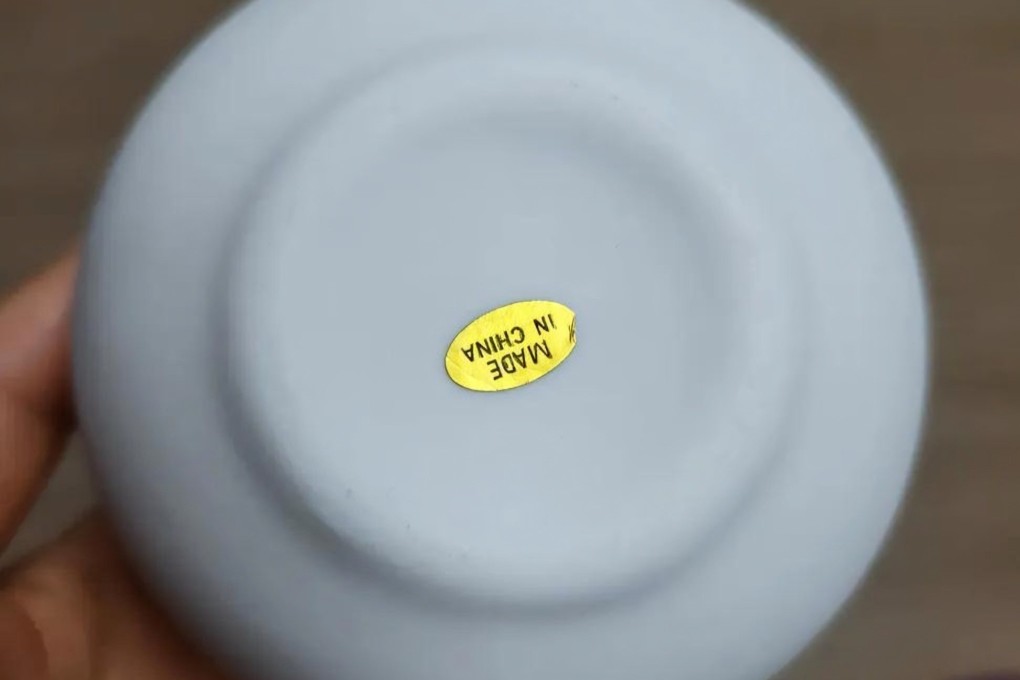 A miniature moon jar bearing a “Made in China” sticker that was received as a prize from an event held during the Yeoju Ceramic Festival in South Korea. Photo: Threads
