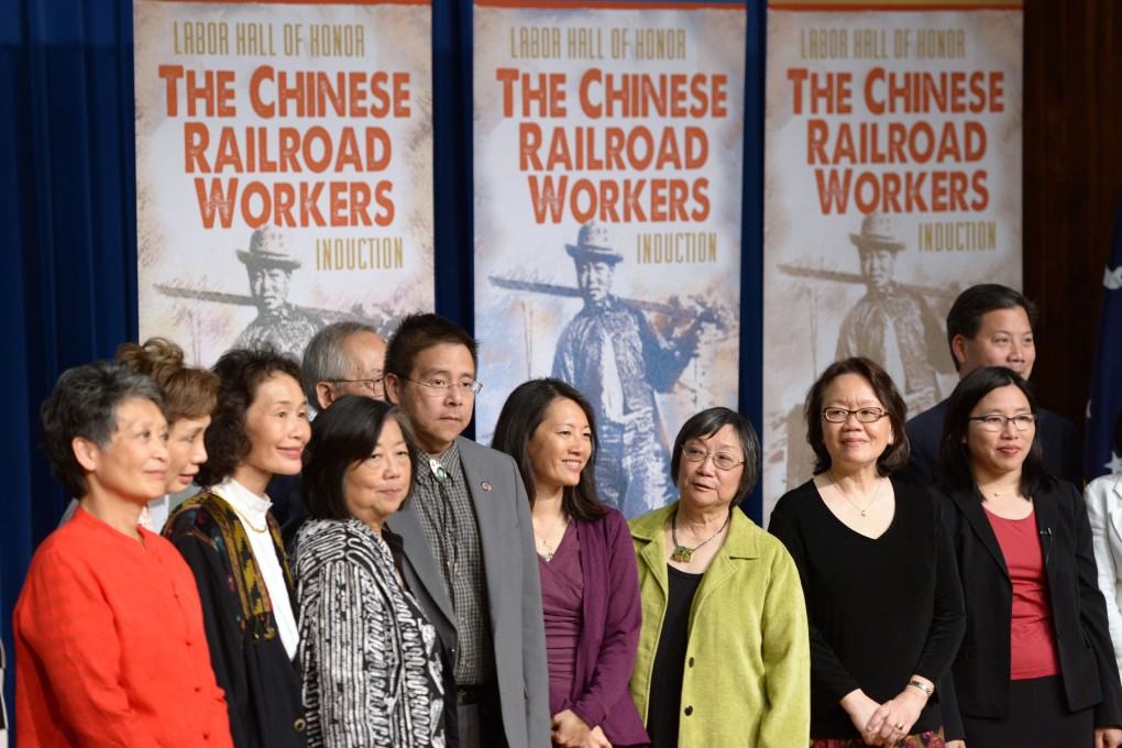 Descendants of Chinese railroad workers gather during a ceremony for 12,000 Chinese immigrant labourers who worked on the Central Pacific Railroad between 1865 and 1869 being inducted into the Labor Hall of Honor, at the Department of Labor, in Washington DC, on May 9, 2014. Photo: Xinhua