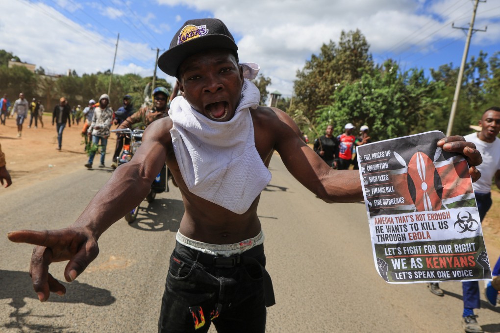 A protester holds up a sign during a rally on Monday against a proposed Ebola quarantine centre to be established by the United States at Laikipia Air Base in Kenya. Photo: AP