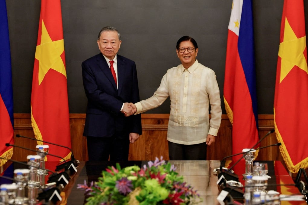 Philippine President Ferdinand Marcos Jnr (right) and Vietnam’s President To Lam shake hands at the Malacanang presidential palace in Manila on Monday. Photo: Reuters