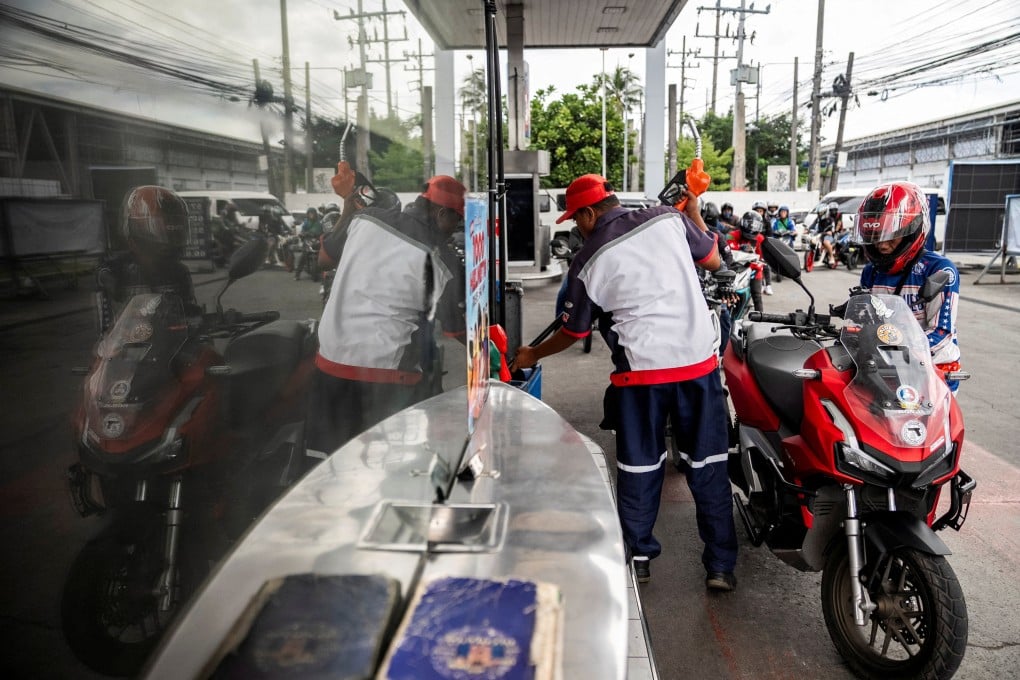A worker fills up a motorcycle at a petrol station in Quezon City, Metro Manila, the Philippines, in March. Photo: Reuters