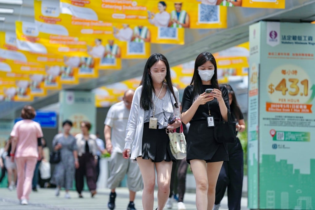 Civil servants step out of the Central Government Offices at lunchtime on May 28. Photo: Karma Lo