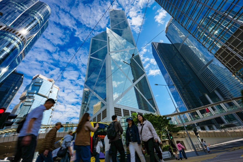 People walk amid office towers in Central on January 26. Average rents for grade A offices in the Central business district grew nearly 6 per cent on a quarterly basis last quarter, while rents for premium buildings in the district surged 12 per cent, the fastest rate since the third quarter of 2010. Photo: Jelly Tse
