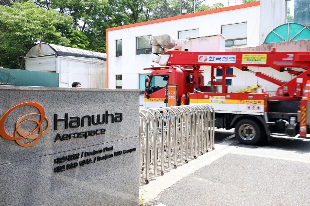 A firefighting vehicle enters the main gate at the Hanwha Aerospace plant in Daejeon, South Korea, on Monday. Photo: Yonhap/AFP