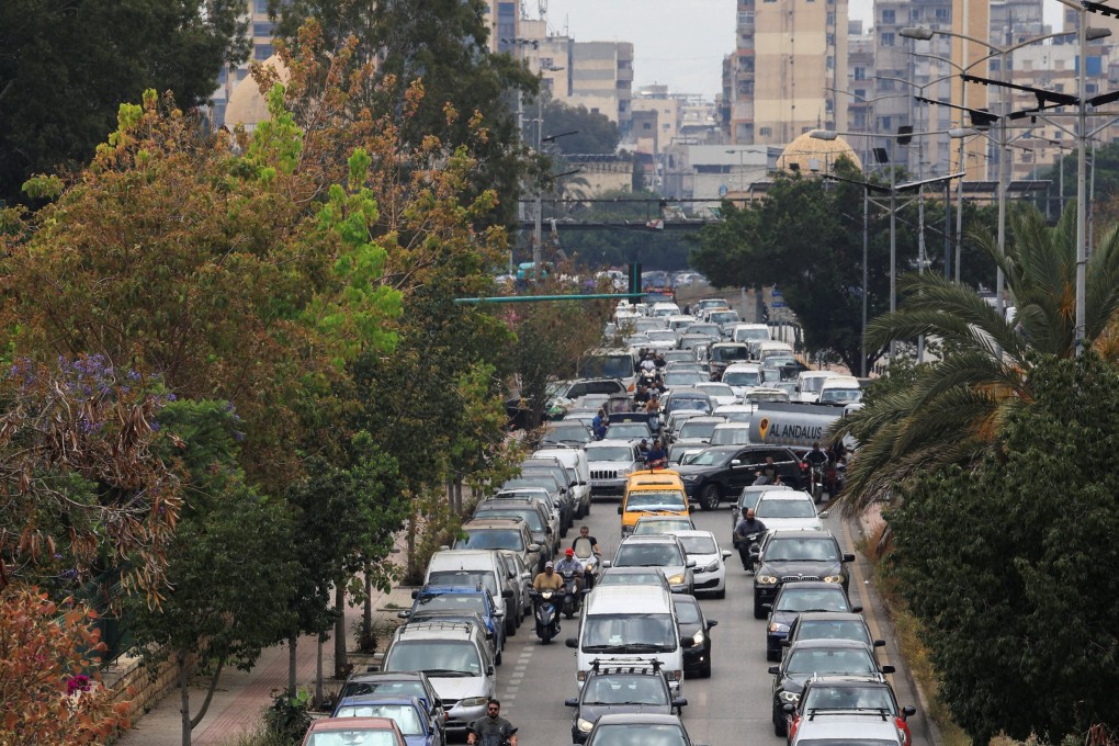 Traffic clogs an exit route as residents flee the southern suburbs of Beirut on Monday. Photo: Reuters