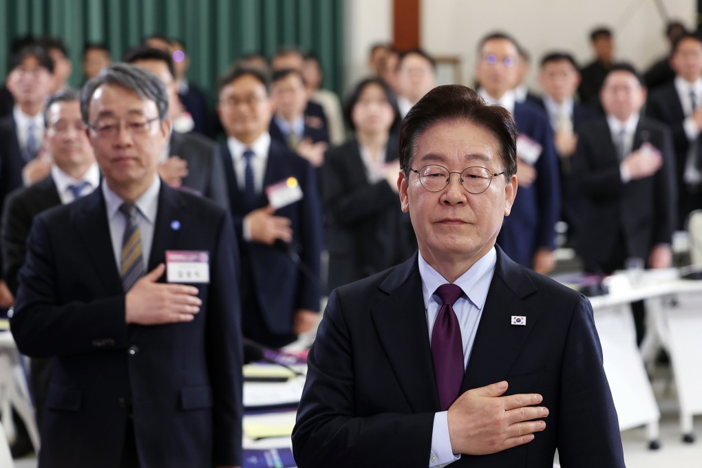South Korean President Lee Jae Myung salutes the national flag at the first plenary meeting of the National Economic Advisory Council, at the presidential office in Seoul, South Korea, on April 9. Photo: EPA/Yonhap