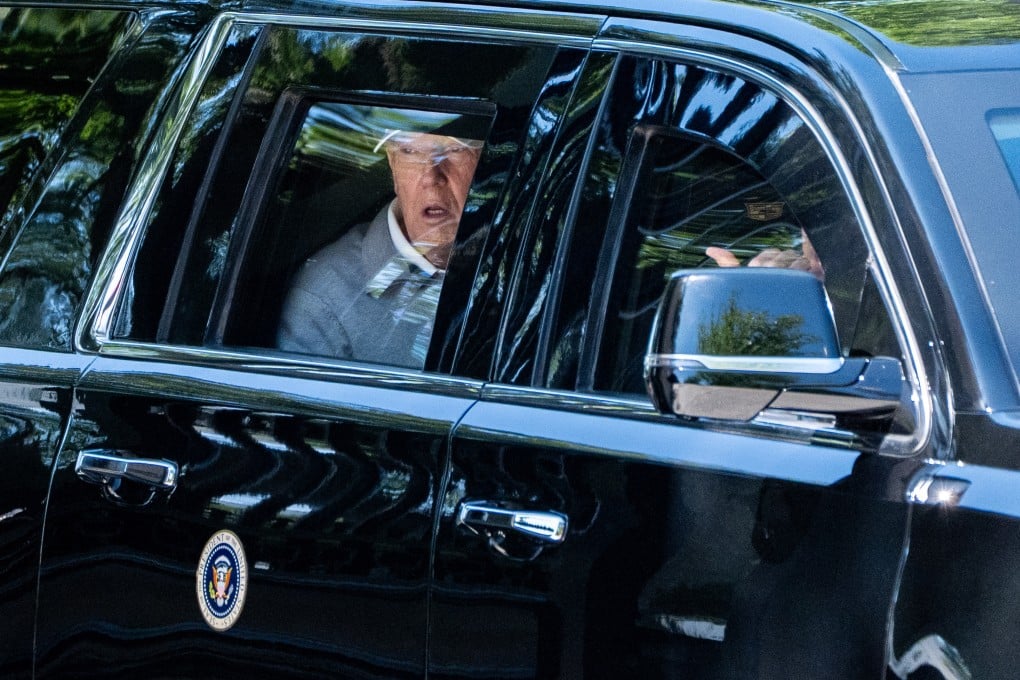 US President Donald Trump looks out the window of his limousine. Photo: AP