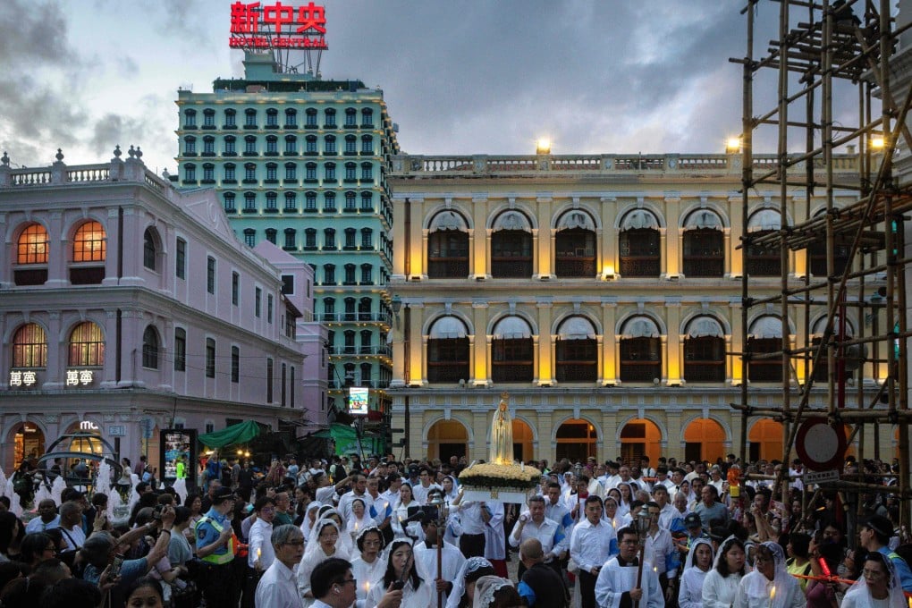 A statue of Our Lady of Fatima is carried through Senado Square in Macau on May 13. Photo: AFP