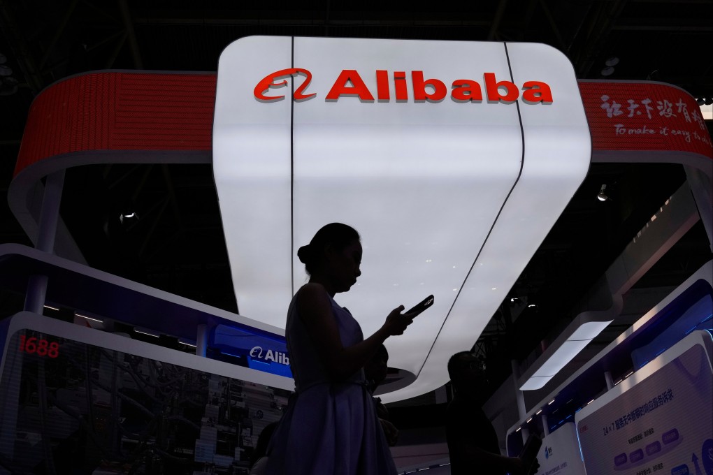 A visitor walks in front of an Alibaba booth during the China International Supply Chain Expo in Beijing on July 18, 2025. Photo: AP Photo