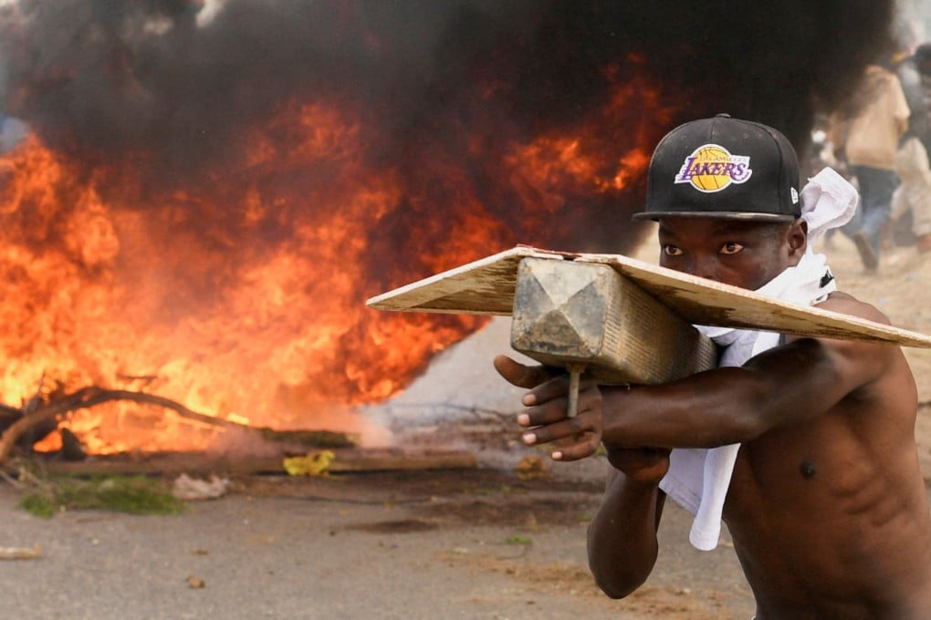 A man takes part in a protest on Monday against a US-backed Ebola quarantine plan on the establishment of a 50-bed facility at a Kenyan air force base that was intended to host Americans exposed to Ebola, in Nanyuki town, in Laikipia County. Photo: Reuters