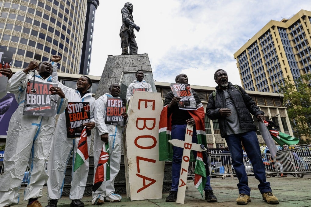Activists shout slogans as they carry a mock coffin during a protest against an Ebola facility in Nairobi, Kenya on Tuesday. Photo: EPA