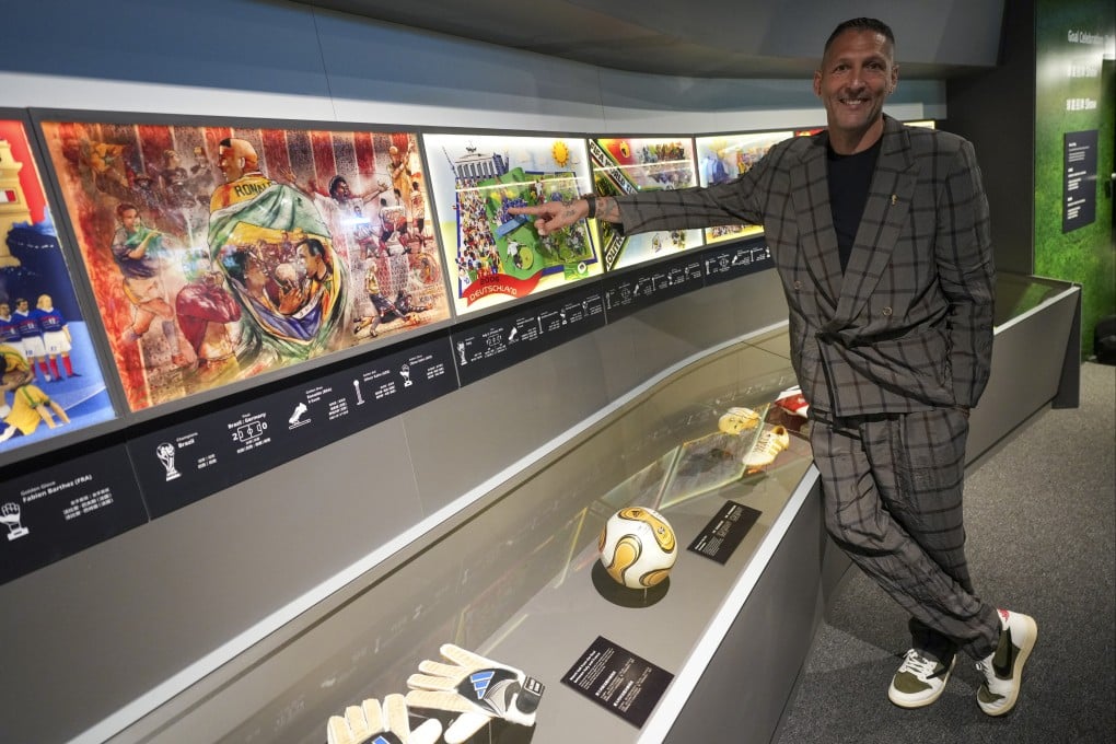 Marco Materazzi stands beside the match ball from the 2006 World Cup final during his visit to the Fifa Museum in Hong Kong. Photo: Sam Tsang.