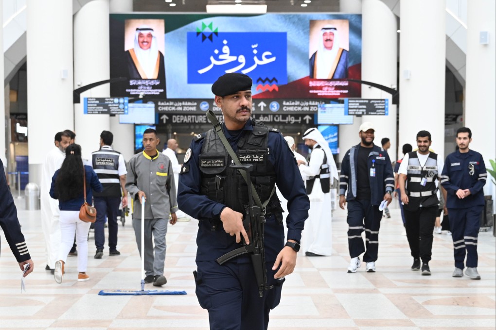 A police officer patrols Terminal 1 at Kuwait International Airport on Monday. Authorities suspended flights on Wednesday. Photo: Xinhua