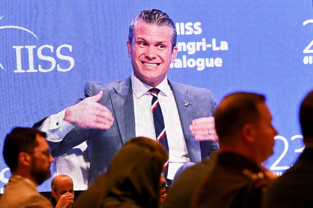 Delegates watch US Defence Secretary Pete Hegseth’s speech on a screen at the Shangri-La Dialogue security summit in Singapore on Saturday. Photo: Reuters
