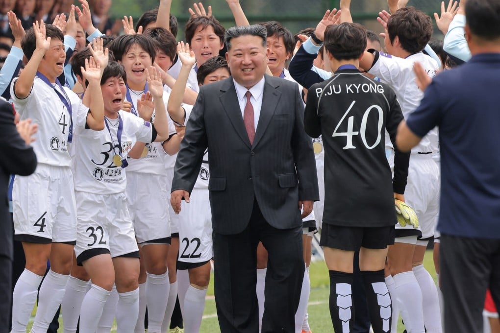 North Korean leader Kim Jong-un congratulates the football players who won the AFC Under-17 Women’s Asian Cup in Pyongyang on Monday. Photo: KCNA/KNS/AFP