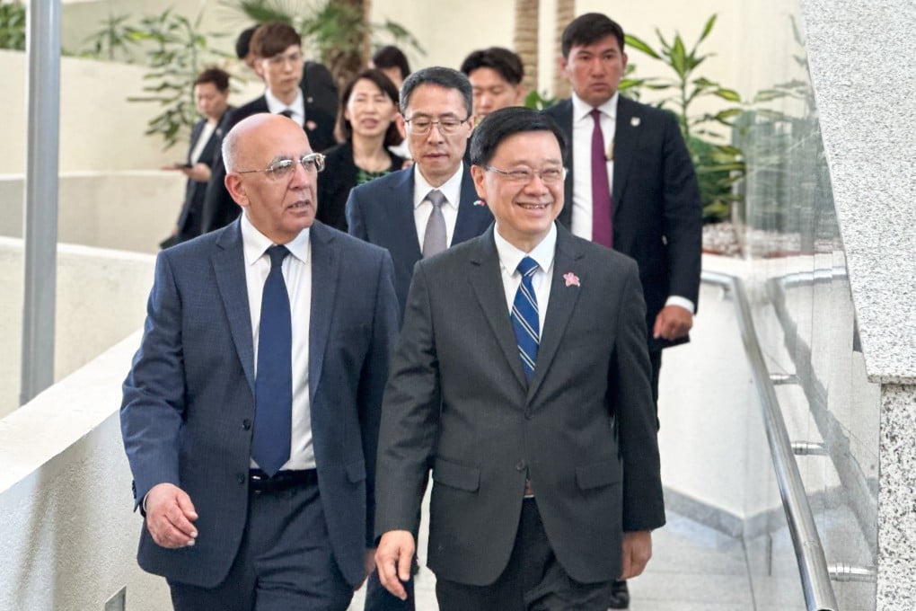 Hong Kong leader John Lee (right) and Professor Waqar Ahmad, president of Nazarbayev University.  Photo: Jeffie Lam