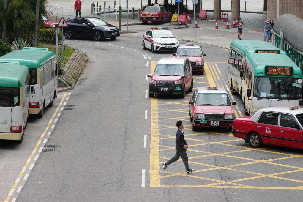 A pedestrian crosses a road in front of traffic in Kwai Fong. Photo: Sam Tsang