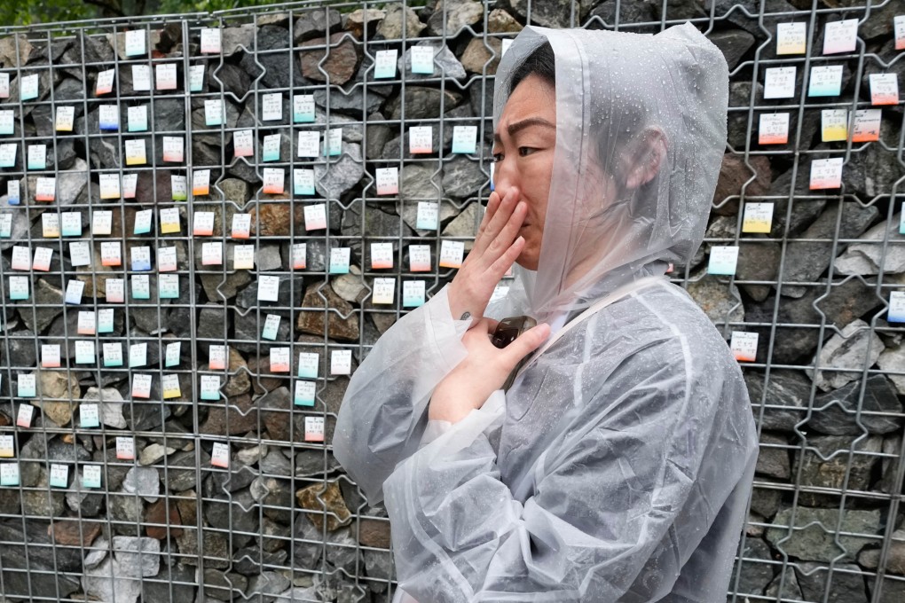 Lisa Robinson, a Korean adoptee from the United States, stands in front of The Wall of Names at Omma Poom Park in Paju, South Korea, on May 20, 2026. Photo: AP/Ahn Young-joon