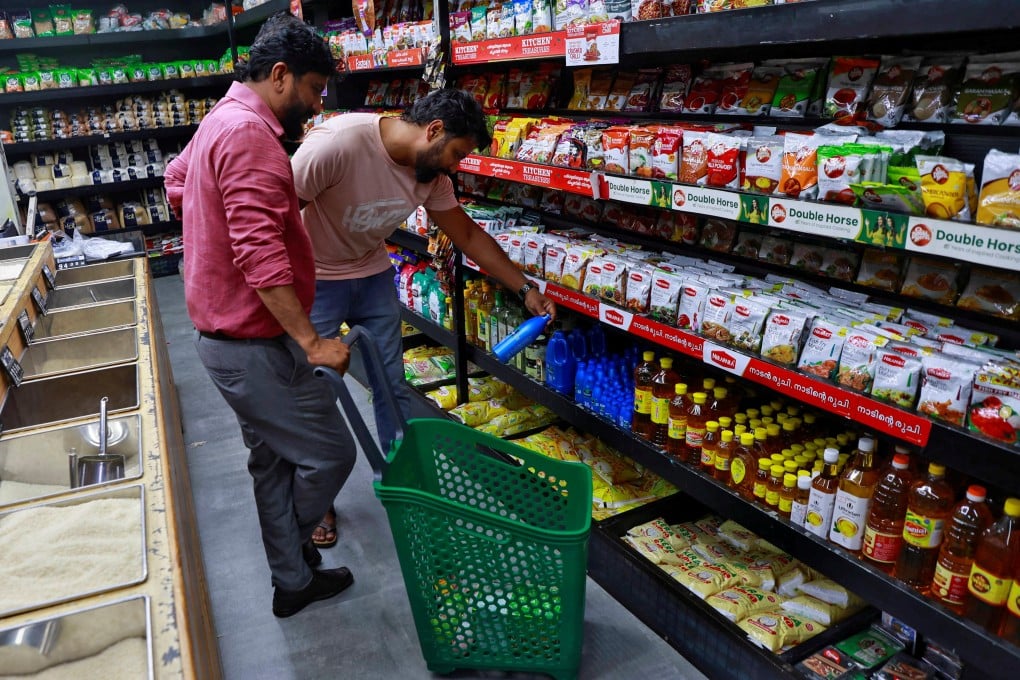 Customers check out products at a retail store in Kochi, India. Photo: Reuters