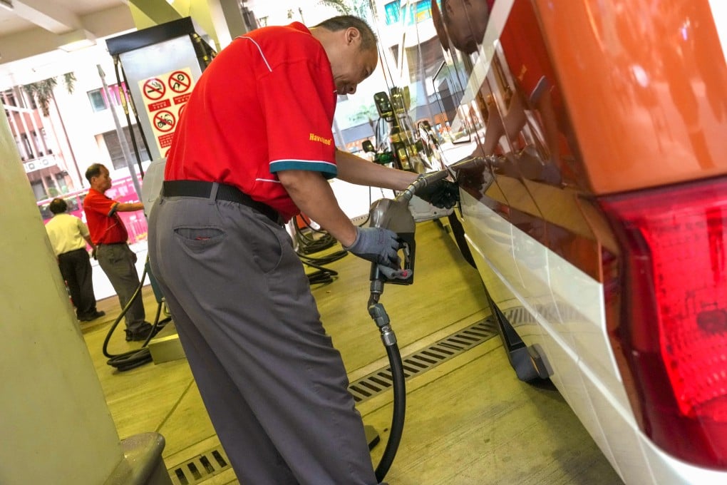 An attendant pumps fuel at a petrol station in Wan Chai on April 10. Photo: Jelly Tse