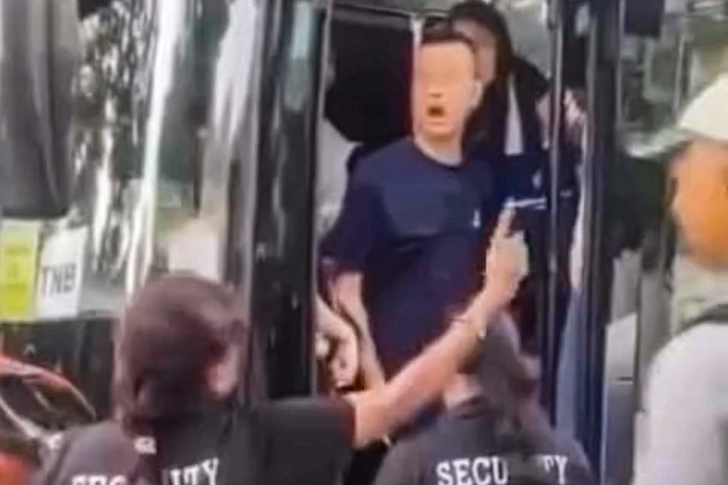 A still from a viral video shows Hong Kong principal Lee Cheuk-hing exchanging heated words with security guards outside a venue during a school trip to Singapore. Lee tendered his resignation to the San Wui Commercial Society Secondary School in Tuen Mun, Hong Kong, after the incident sparked online outrage, but it was rejected; the school has instead opted to fire him.