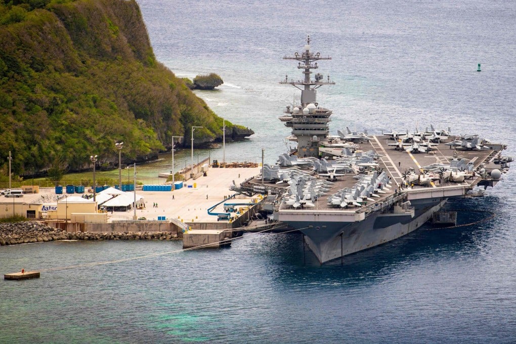 Aircraft carrier USS Theodore Roosevelt (CVN 71) moored pier side at Naval Base Guam in Micronesia. The US military has quietly pulled its most precious military assets away from Asian coasts, beyond the reach of most conventional missiles. Photo: US Navy/AFP