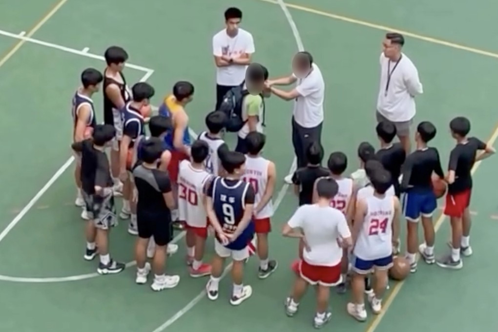 A still from a video in which basketball coach Yung Kam-wah is seen forcing a player to slap himself on the face as a punishment during a training at a secondary school. Photo: Handout