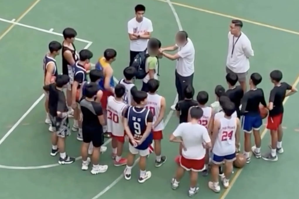 A still from a video in which basketball coach Yung Kam-wah is seen forcing a player to slap himself on the face as a punishment during a training at a secondary school. Photo: Handout